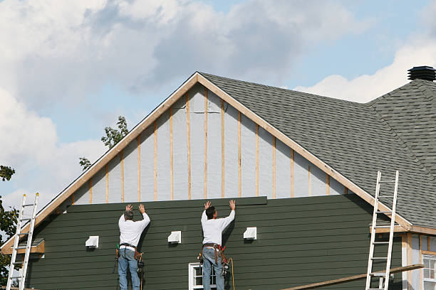 Professional Vinyl Siding technician working in Bohemia, NY